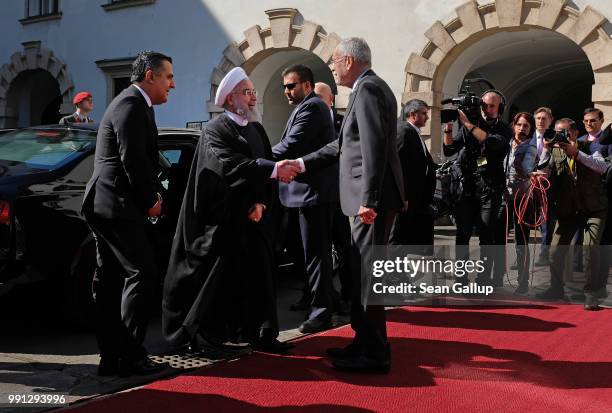 Austrian President Alexander van der Bellen greets Iranian President Hassan Rouhani at Hofburg Palace on July 4, 2018 in Vienna, Austria. Rouhani is...