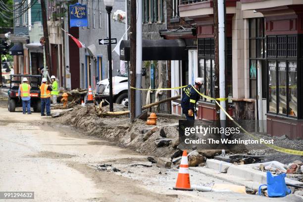 Howard County Special Operations worker checks on businesses on Main Street May 29, 2018 in Ellicott City, MD. This comes two years after another...