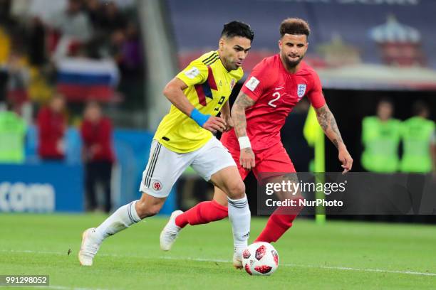 Forward Radamel Falcao of Colombia National team and defender Kyle Walker of England National team during the round of 16 match between Colombia and...