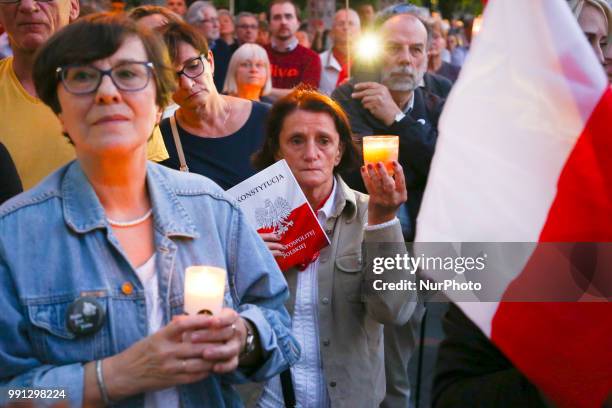 Protestor holds a copy of Polish Constitution during a protest against Supreme Court Reforms in Poland. Krakow, Poland on 3 July, 2018.