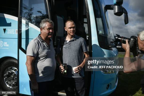 Great Britain's Christopher Froome poses with the bus driver as he prepares to board his Team Sky cycling team bus, departing from his hotel for a...