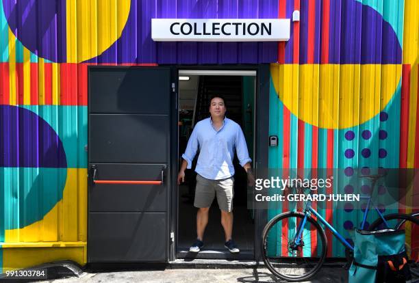 Co-founder and CEO of Deliveroo, William Shu, poses in the entrance of first kitchen Deliveroo Editions in France new concept of kitchen shared, on...