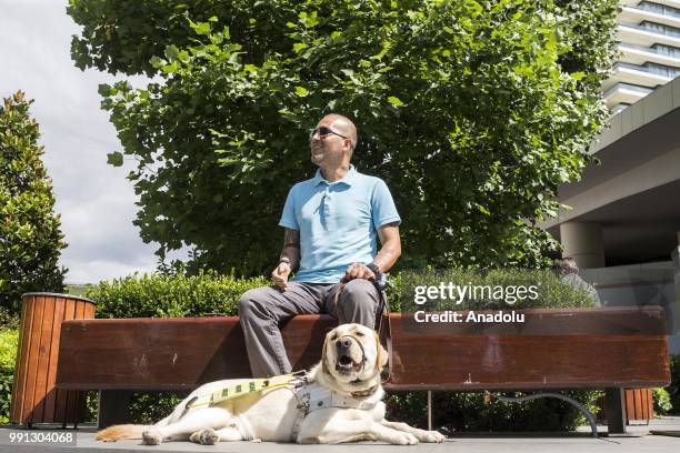Veteran Gendarmery Sergeant Hasan Arisoy , who lost his sight ability and his right hand after a mine bomb blasted in Cukurca, is seen with his guide...