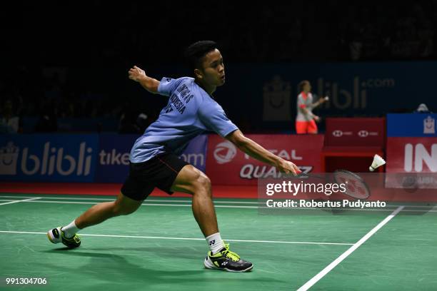 Anthony Sinisuka Ginting of Indonesia competes against Mark Caljouw of Netherlands during the Men's Singles Round 1 match on day two of the Blibli...