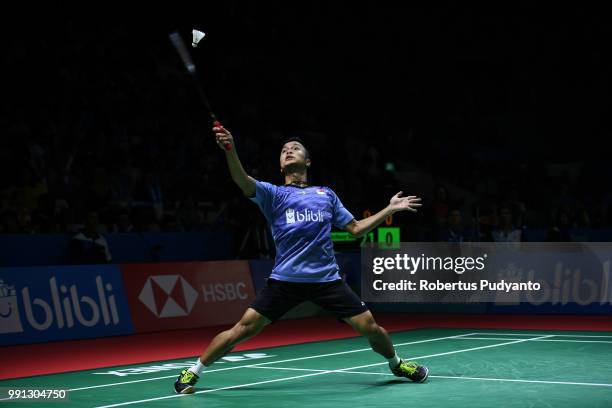 Anthony Sinisuka Ginting of Indonesia competes against Mark Caljouw of Netherlands during the Men's Singles Round 1 match on day two of the Blibli...