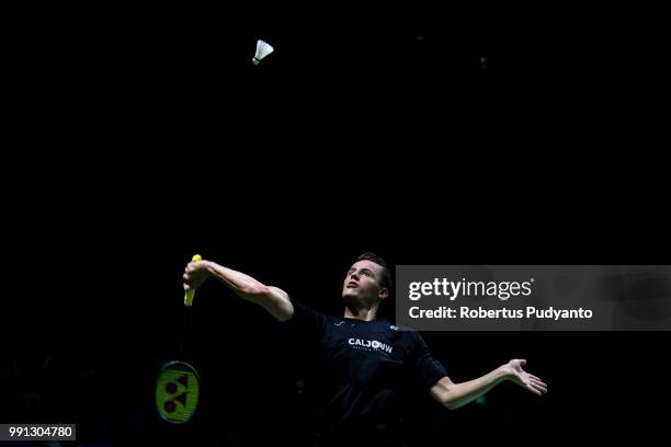 Mark Caljouw of Netherlands competes against Anthony Sinisuka Ginting of Indonesia during the Men's Singles Round 1 match on day two of the Blibli...