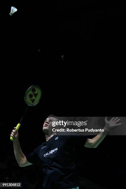 Mark Caljouw of Netherlands competes against Anthony Sinisuka Ginting of Indonesia during the Men's Singles Round 1 match on day two of the Blibli...