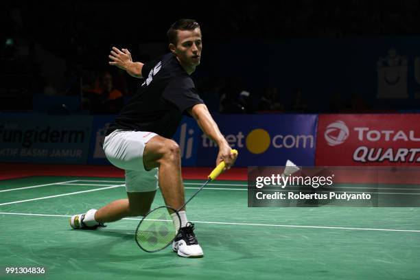 Mark Caljouw of Netherlands competes against Anthony Sinisuka Ginting of Indonesia during the Men's Singles Round 1 match on day two of the Blibli...