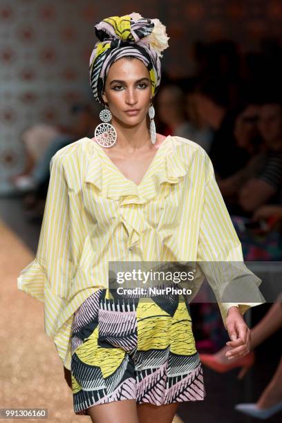 Model Talia Graf runs the runway during the Marc Cain Spring/Summer 2019 Fashion Show at Westhafen in Berlin, Germany on July 3, 2018.