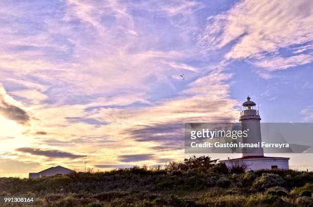 lighthouse and clouds - ismael stock pictures, royalty-free photos & images