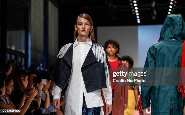 Models walk the runway at the Greenshowroom Selected show during the Berlin Fashion Week Spring/Summer 2019 at ewerk on July 3, 2018 in Berlin,...