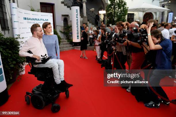 July 2018, Germany, Munich: Samuel Koch and Sarah Elena Koch attend the Bavaria Film reception at the Kuenstlerhaus, an event hosted on occasion of...