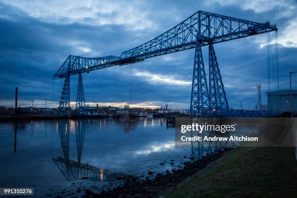 The Tees Transporter Bridge at dusk overlooking the River Tees, Middlesbrough, North Yorkshire, United Kingdom. Tees Transporter Bridge is one of...