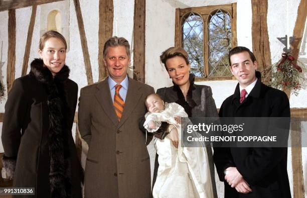 Belgium's Prince Philippe and Princess Mathilde pose with Prince Emmanuel, and his godfather and godmother Prince Guillaume of Luxembourg and...