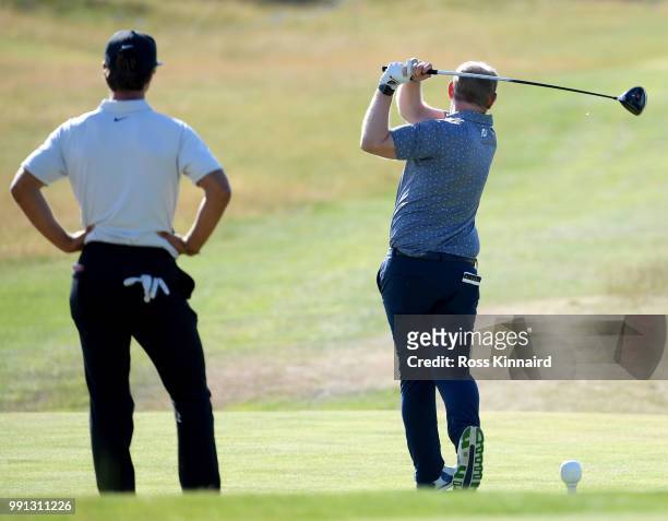 Thorbjorn Olesen of Denmark watches his pro am partner Enda Keane during the pro-am event prior to the Dubai Duty Free Irish Open at Ballyliffin Golf...