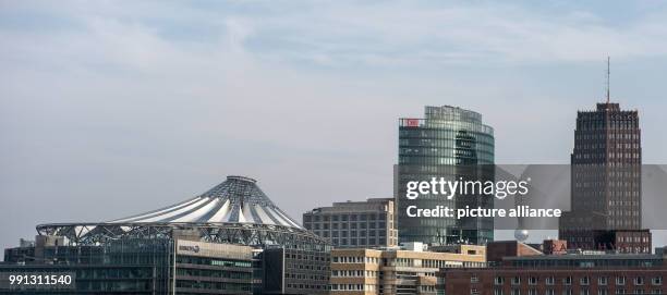 Cityscape view of the roof of the Sony Center , the office building of the Deutsche Bahn railway company and the so-called Kollhoff office highrise...