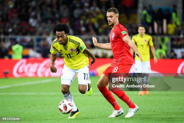 Juan Cuadrado of Colombia and Jordan Henderson of England during the 2018 FIFA World Cup Russia Round of 16 match between Colombia and England at...