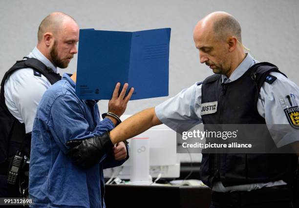 The 24-year-old defendant is lead into the court room at the upper district court in Stuttgart, Germany, 9 November 2017. The 24-year-old is...