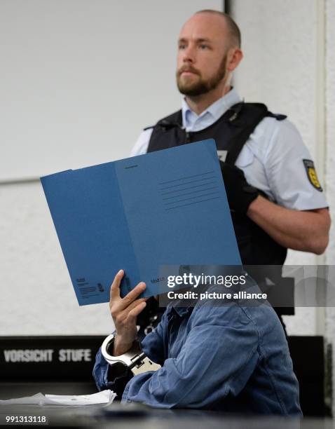 The 24-year-old defendant sits in the court room at the upper district court in Stuttgart, Germany, 9 November 2017. The 24-year-old is suspected of...