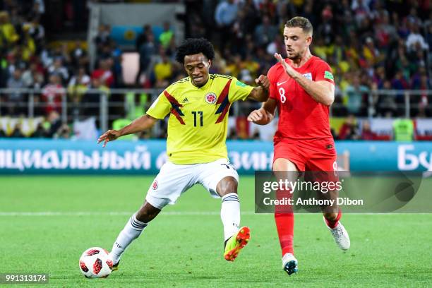 Juan Cuadrado of Colombia and Jordan Henderson of England during the 2018 FIFA World Cup Russia Round of 16 match between Colombia and England at...