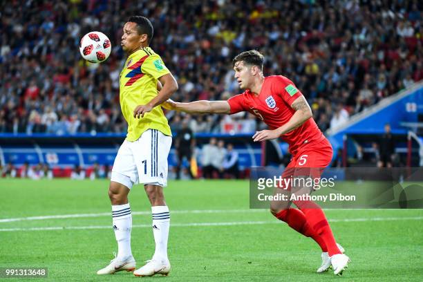 Carlos Bacca of Colombia and John Stones of England during the 2018 FIFA World Cup Russia Round of 16 match between Colombia and England at Spartak...