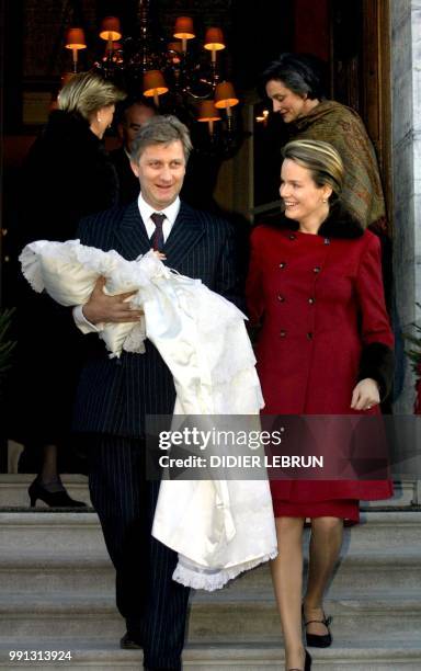 Crown Prince Philippe holding Princess Elisabeth and Princess Mathilde of Belgium come out of the Chapel of Ciergnon 09 December 2001, after Cardinal...