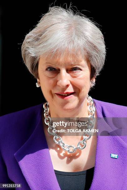 Britain's Prime Minister Theresa May leaves 10 Downing Street in London on July 4, 2018 ahead of the weekly Prime Minister's Questions session in the...