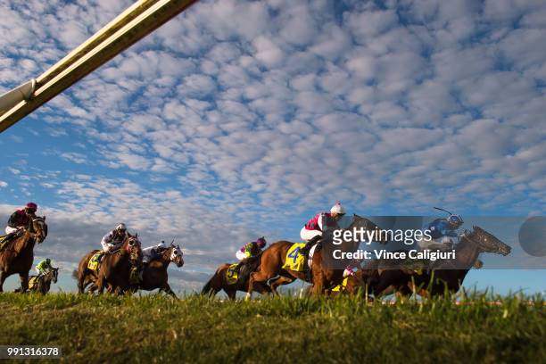 Andrew Mallyon riding Al Khabeer and Fred Kersley riding Kaptive Hero in Race 7 during Melbourne Racing at Sandown Hillside on July 4, 2018 in...