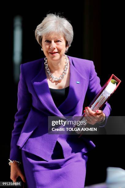 Britain's Prime Minister Theresa May leaves 10 Downing Street in London on July 4, 2018 ahead of the weekly Prime Minister's Questions session in the...