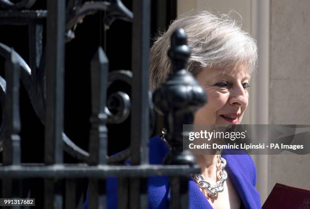 Prime Minister Theresa May leaves 10 Downing Street in Westminster, London, to attend Prime Minister's Questions at the House of Commons.