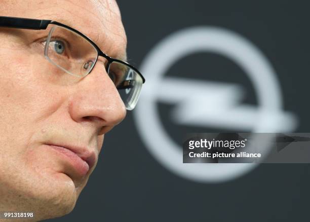 Michael Lohscheller, Opel Automobile's CEO, with the company's logo in the background while looking on the crowd during a press conference at the...