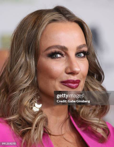 Television personality Amber Nichole Miller speaks to an interviewer during the 10th annual Fighters Only World Mixed Martial Arts Awards at Palms...