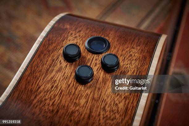 Detail of the volume, tone and blend controls on a Faith PJE Legacy Earth electro-acoustic guitar, taken on November 7, 2017.