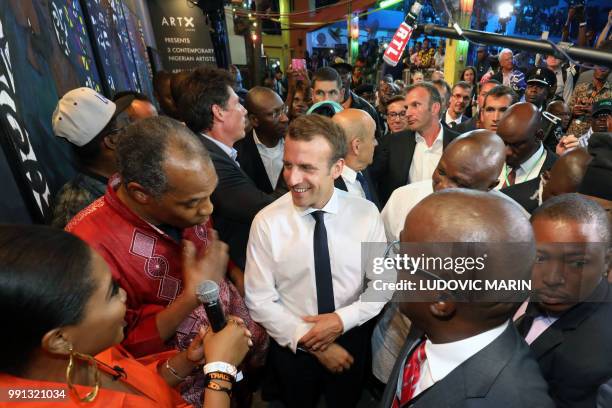 French President Emmanuel Macron arrives to take part of a live show in the Afrika Shrine in Lagos on July 3, 2018. - French President Emmanuel...