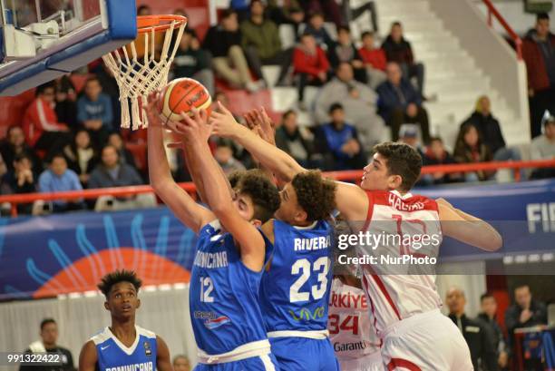 Furkan Haltali of Turkey vies Isaiah Stone Rivera and Giancarlo Bastianoni Sanchez of Dominican Republic during Fiba U17 Basketball World Cup 2018...