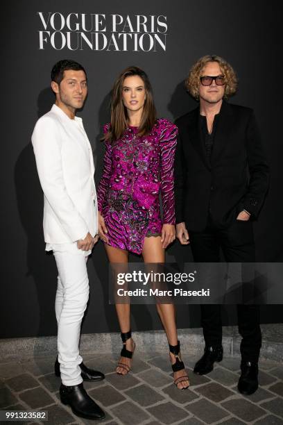 Evangelo Bousis, Alessandra Ambrosio and Peter Dundas attends the Vogue Foundation Dinner Photocall as part of Paris Fashion Week - Haute Couture...