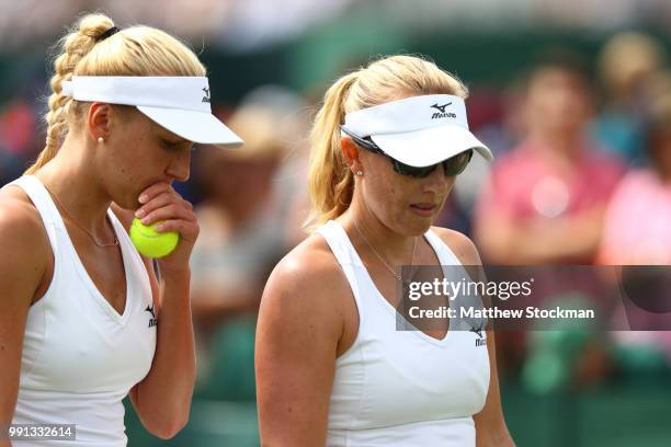 Nadiia Kichenok of Ukraine and Anastasia Rodionova of Australia discuss tactics during their Ladies Doubles first round match against Anastasia...