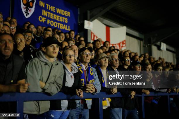 Anxious home fans watching in the 2nd half of the AFC Wimbledon v MK Dons League One match at Cherry Red Records Stadium on September 22nd 2017 in...