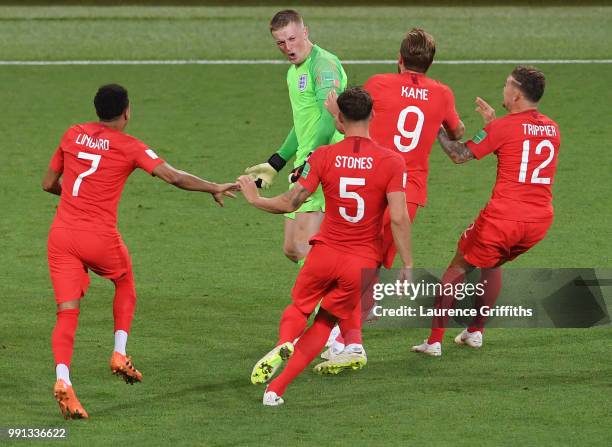 Jordan Pickford of England is congratulated by Jesse Lingard, John Stones, Harry Kane and Kieran Trippier after victory during the 2018 FIFA World...