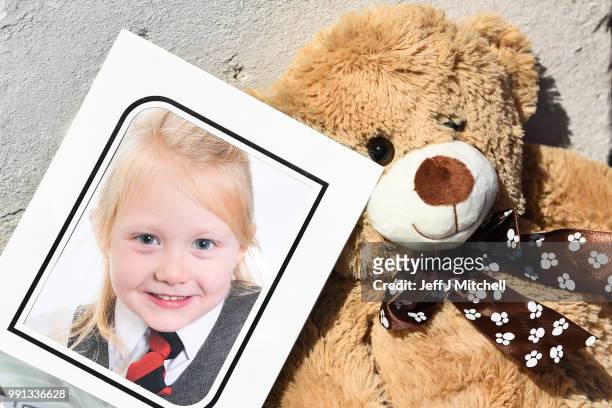 School picture of Alesha MacPhail is left at a house on Ardbeg road on July 4, 2018 in Rothesay, Isle of Bute, Scotland.The case has become a murder...