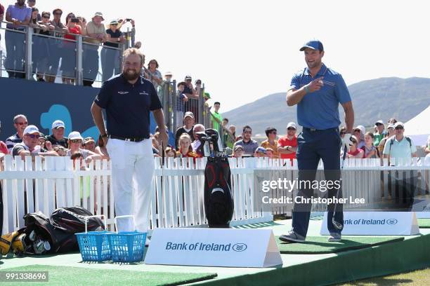 Player Michael Murphy of Donegal gets some tips on golf from Shane Lowry of Ireland as they compete in the GAA AllStar Challenge during the Dubai...