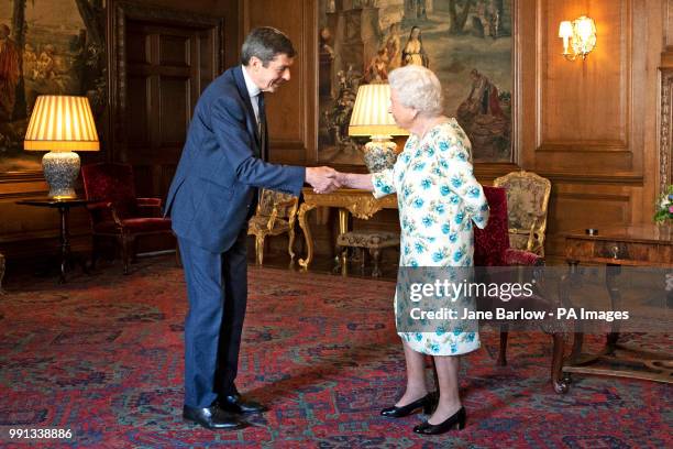 Queen Elizabeth II talks to the Presiding Officer of the Scottish Parliament, Ken Macintosh, during an audience at the Palace of Holyrood House in...