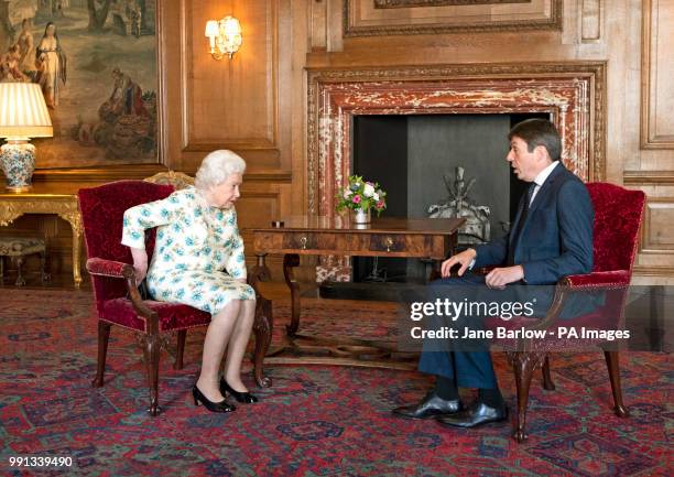 Queen Elizabeth II talks to the Presiding Officer of the Scottish Parliament, Ken Macintosh, during an audience at the Palace of Holyrood House in...