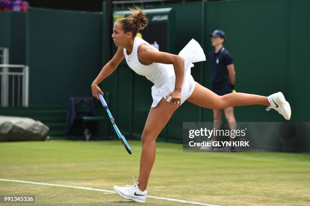 Player Madison Keys serves to Thailand's Luksika Kumkhum during their women's singles second round match on the third day of the 2018 Wimbledon...