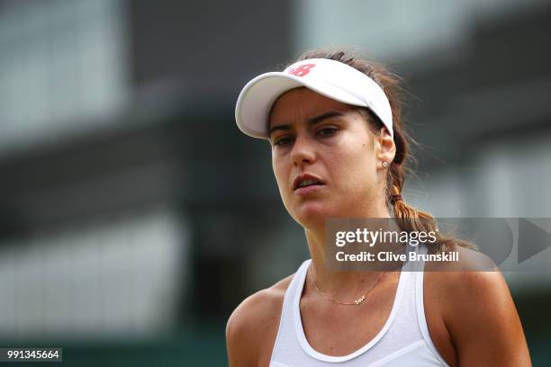 Sorana Cirstea of Romania looks on during her Ladies' Singles second round match against Evgeniya Rodina of Russia on day three of the Wimbledon Lawn...