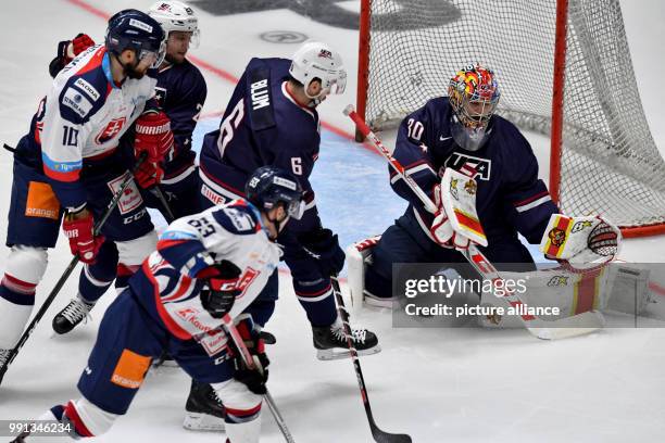 Patrik Lamper scores the 1-0 goal in the first third of the game past Ryan Zapolski , goalkeeper of USA during the Ice hockey Deutschland Cup match...