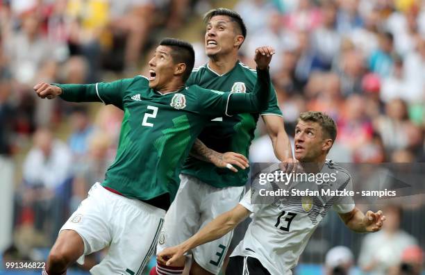 Thomas Mueller of Germany Hugo Ayala of Mexico Carlos Salcedo of Mexico during the 2018 FIFA World Cup Russia group F match between Germany and...