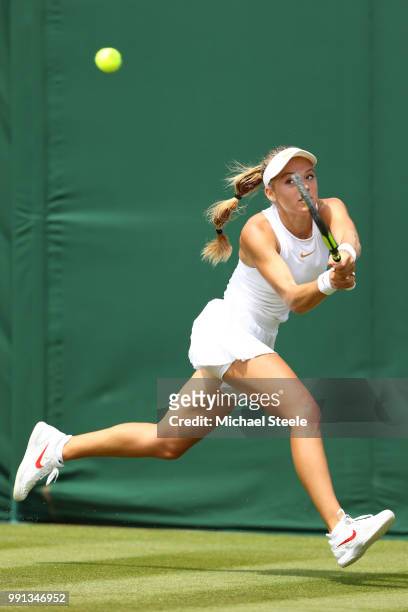 Katie Swan of Great Britain returns against Mihaela Buzarnescu of Romania during their Ladies' Singles second round match on day three of the...