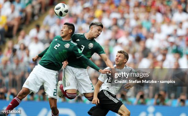 Thomas Mueller of Germany Hugo Ayala of Mexico Carlos Salcedo of Mexico during the 2018 FIFA World Cup Russia group F match between Germany and...