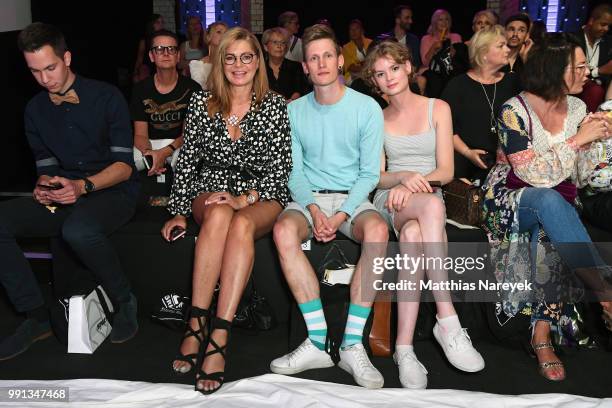 Maren Gilzer, Lars Urban and a guest attend the Rebekka Ruetz show during the Berlin Fashion Week Spring/Summer 2019 at ewerk on July 4, 2018 in...